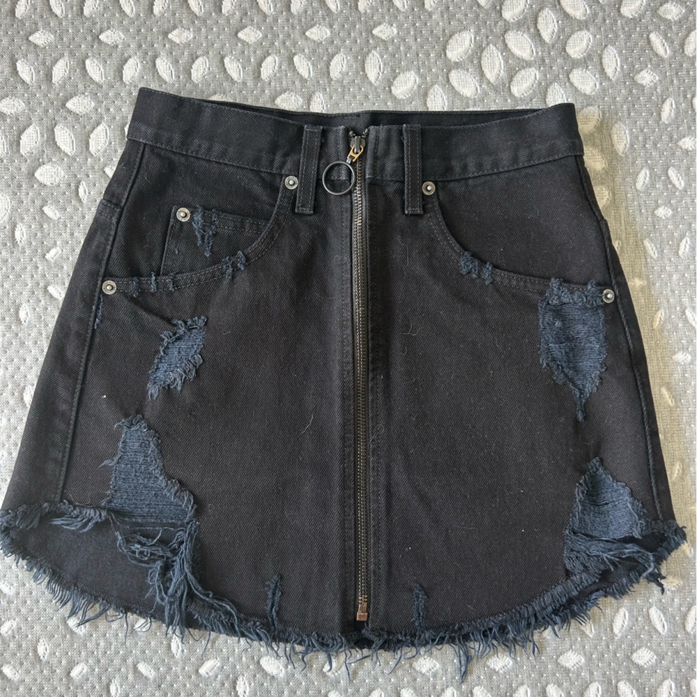 Carmar denim black skirt with front zipper. Size 24